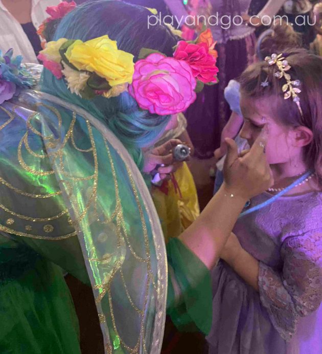 Getting glitter make up at The Royal Princess Ball Image Credit Susannah Marks