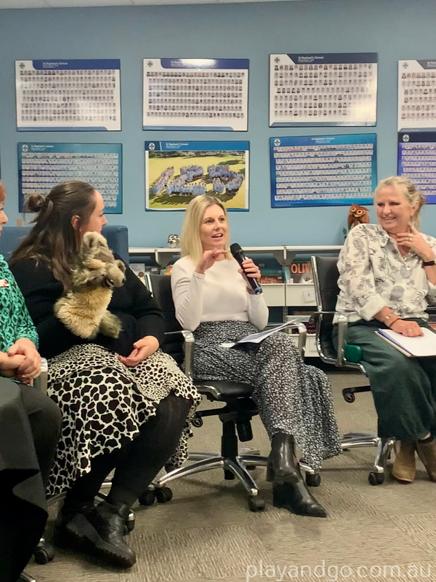 Bec Hughes from Raising Literacy Australia speaks at the literacy panel discussion. Caitlin Hadrill from Unley Library holds a puppet next to her.